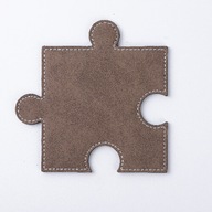 Kožené puzzle v tvare sivého puzzle