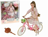 Bábika Emily, ružový bicykel, prilba, kvet Bábika Emily, ružový bicykel, prilba, kvet