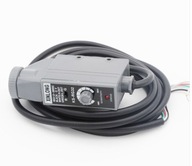 y fotoelektrický spínač baliaceho stroja