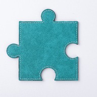 Kožené puzzle v tvare zeleného puzzle